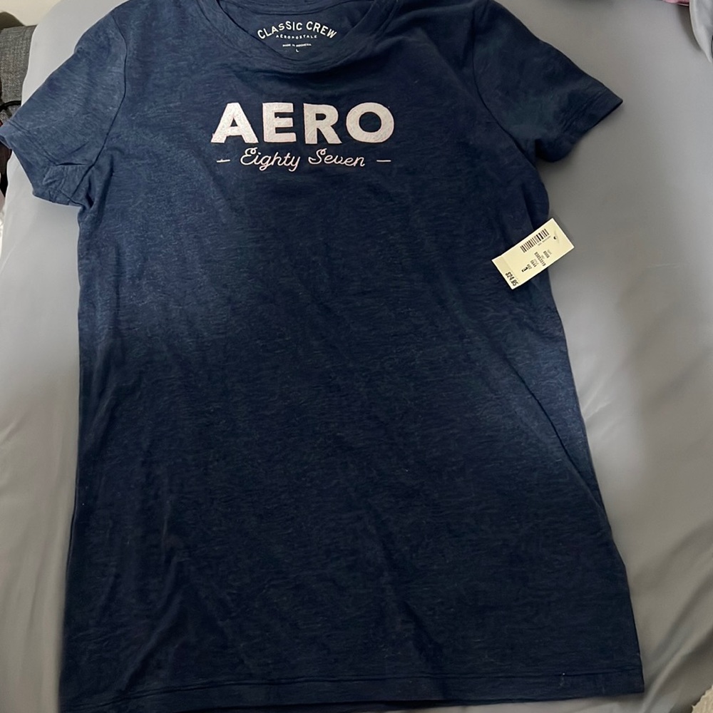 Navy blue, large t-shirt. New, never worn. Not true size, runs small.